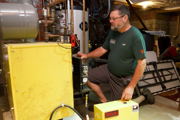 Noonan Energy HVAC technician doing a boiler repair to avoid carbon monoxide leak