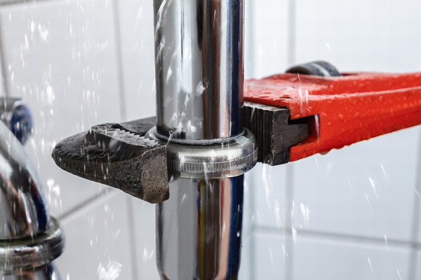 plumbing pipe wrench and plumber