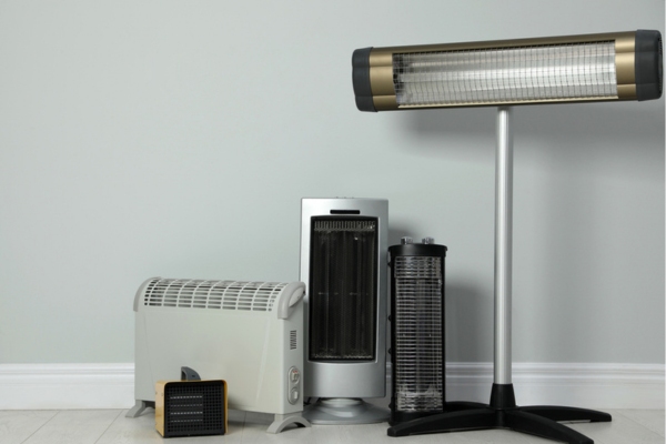 different types of space heaters on the floor