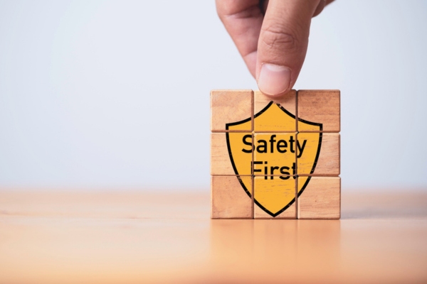 safety first icon puzzle built using wooden blocks depicting safety when handling electricity