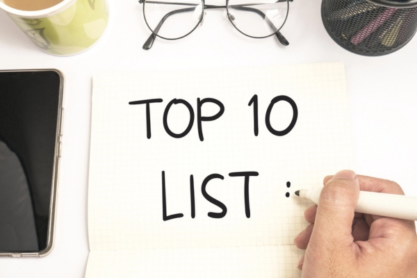 top 10 list written on paper depicting tips to save on oil heating costs