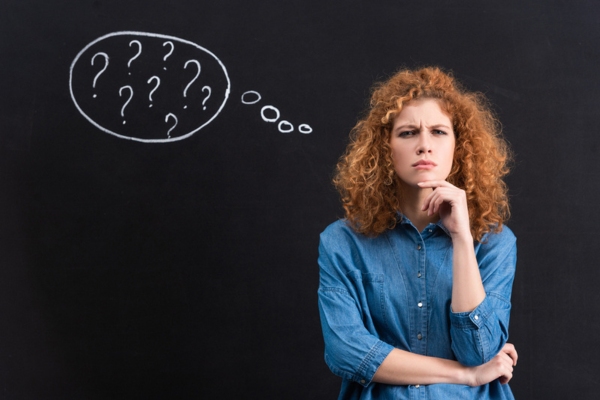 woman with thought balloon of questions depicting FAQs about water softening maintenance