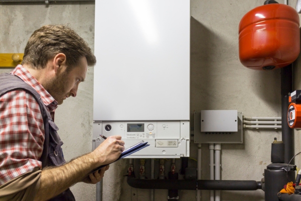 HVAC technician checking out boiler that won't turn on