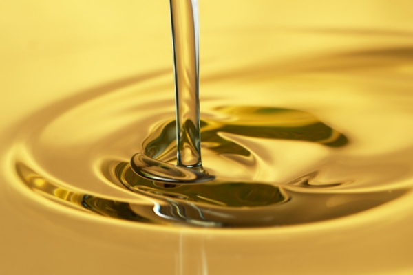 gold liquid being poured depicting heating oil composition