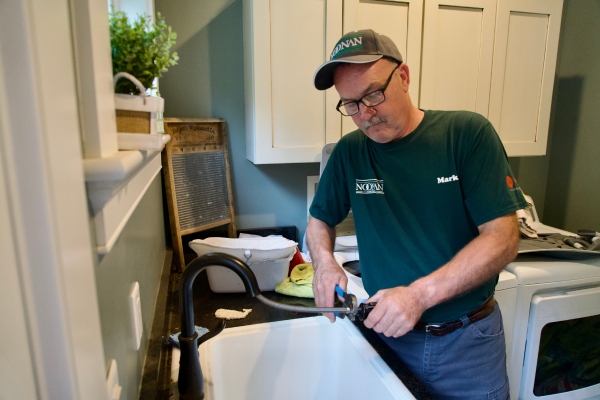 Noonan Energy professional licensed plumber servicing a client