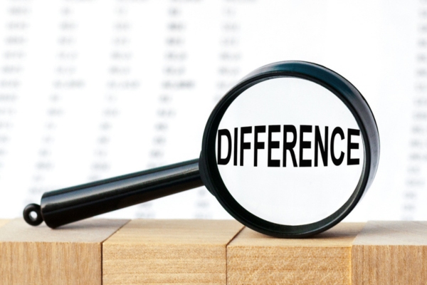 difference highlighted by a magnifying glass depicting furnace and boiler distinctions