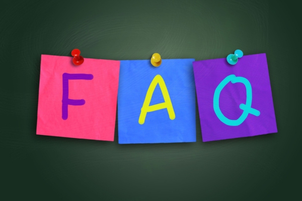 FAQ on colored paper pinned on a board depicting questions about AFUE vs AFUE2