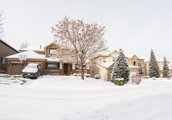 heavy snowfall covering the houses and street due to extremely low temperature