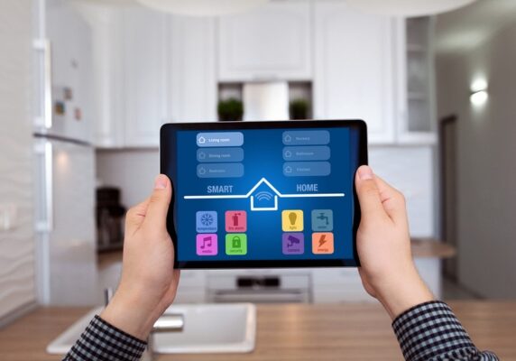 homeowner holding a tablet for a smart home control