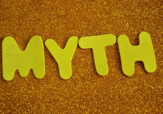 myth spelled using cutout paper on a glittery surface depicting plumbing